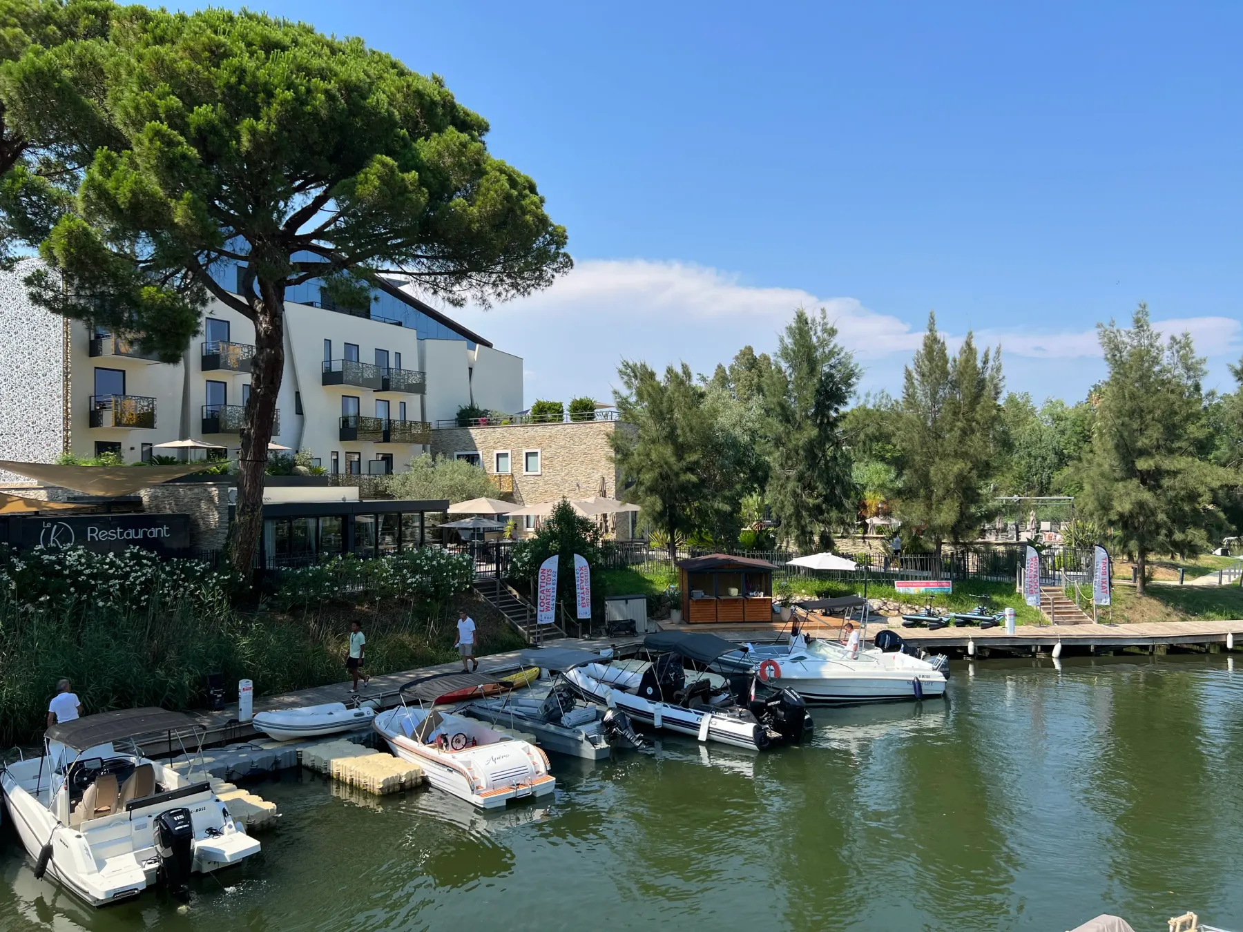 the hotel and the marina with the boats